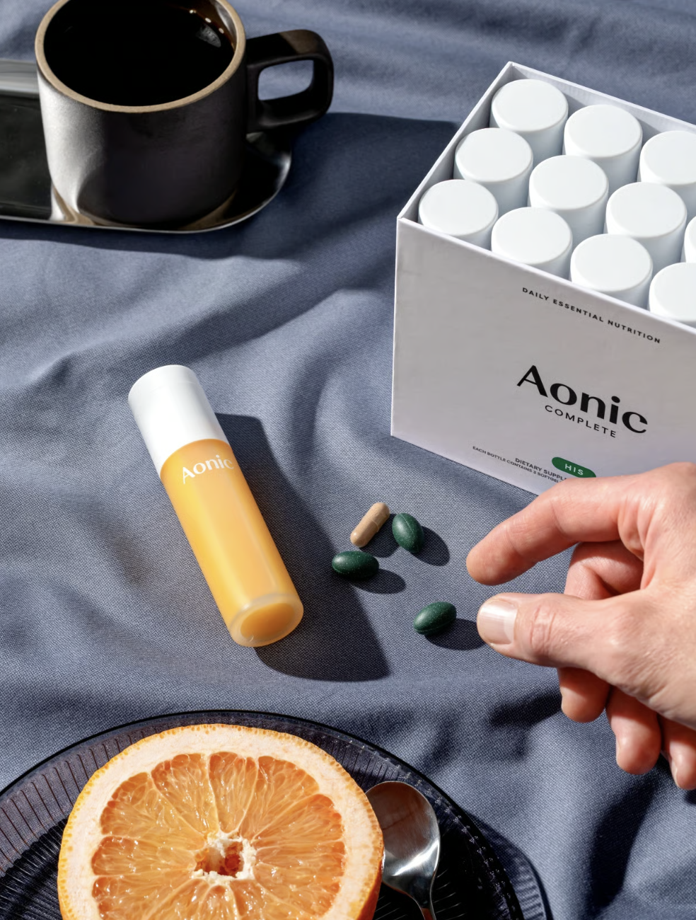 Aonic Complete daily ritual with coffee, grapefruit, and softgels